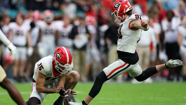 Dec 30, 2023; Miami Gardens, FL, USA; Georgia Bulldogs place kicker Peyton Woodring (91) kicks a PAT against the Florida State Seminoles during the first half in the 2023 Orange Bowl at Hard Rock Stadium. (Nathan Ray Seebeck / USA TODAY Sports).